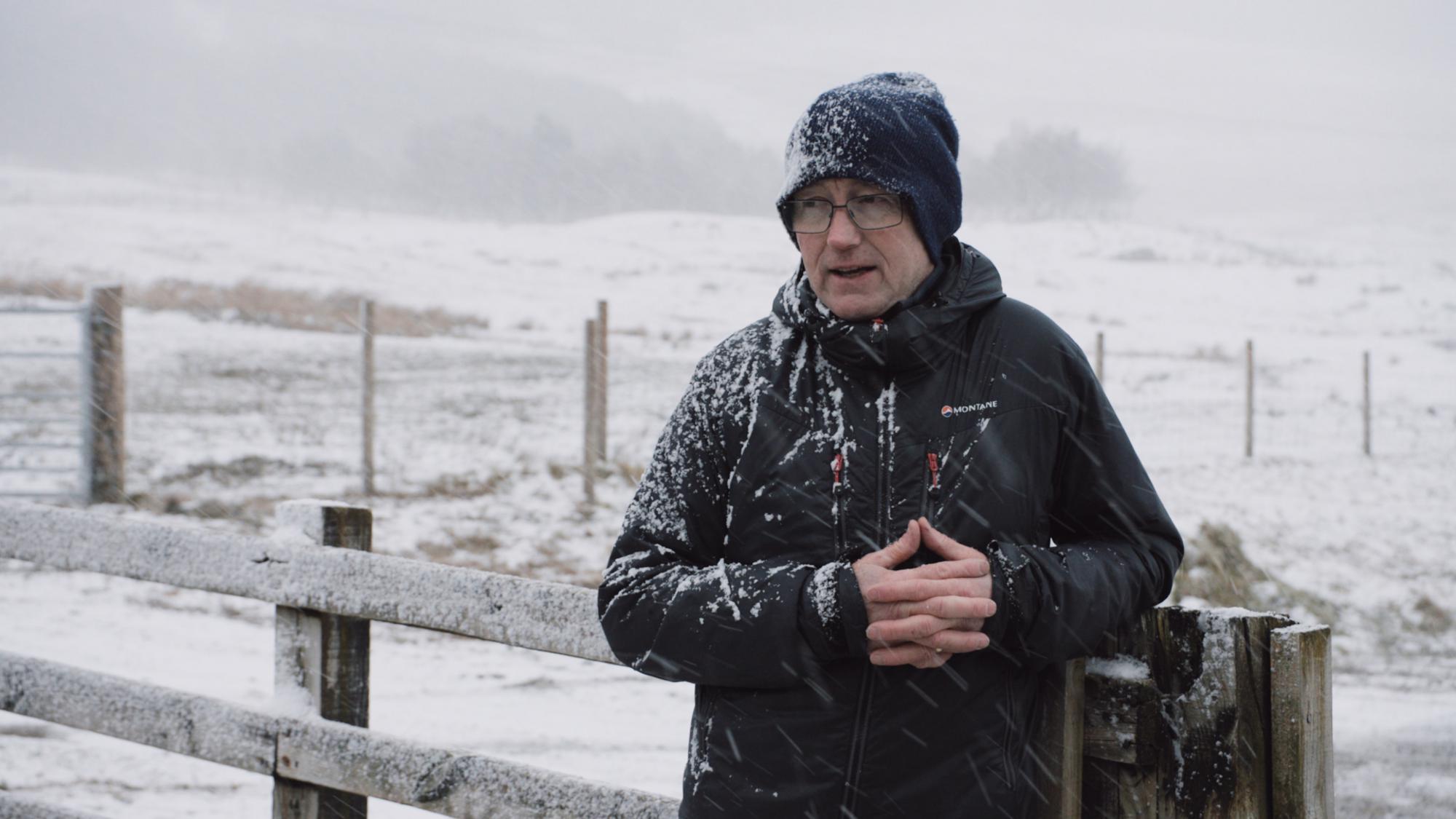 Colin Morrison of Angus Davidson being interviewed for a Peatland ACTION Case study whilst its snowing. Copyright Swift Films Naturescot Peatland ACTION.